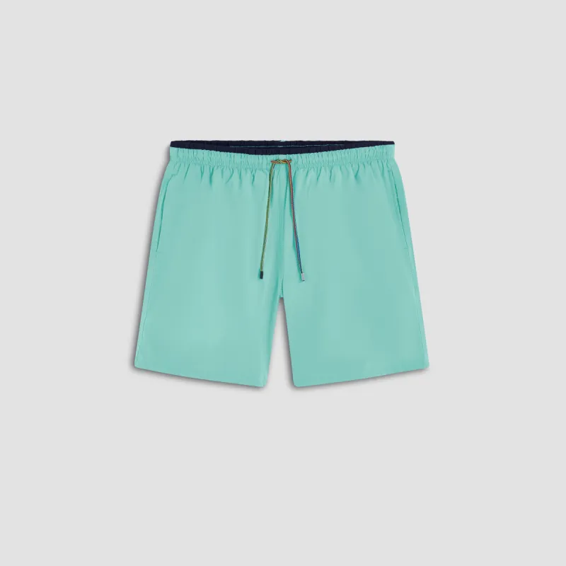 Quinn Solid Swim Trunks sold by Bugatchi