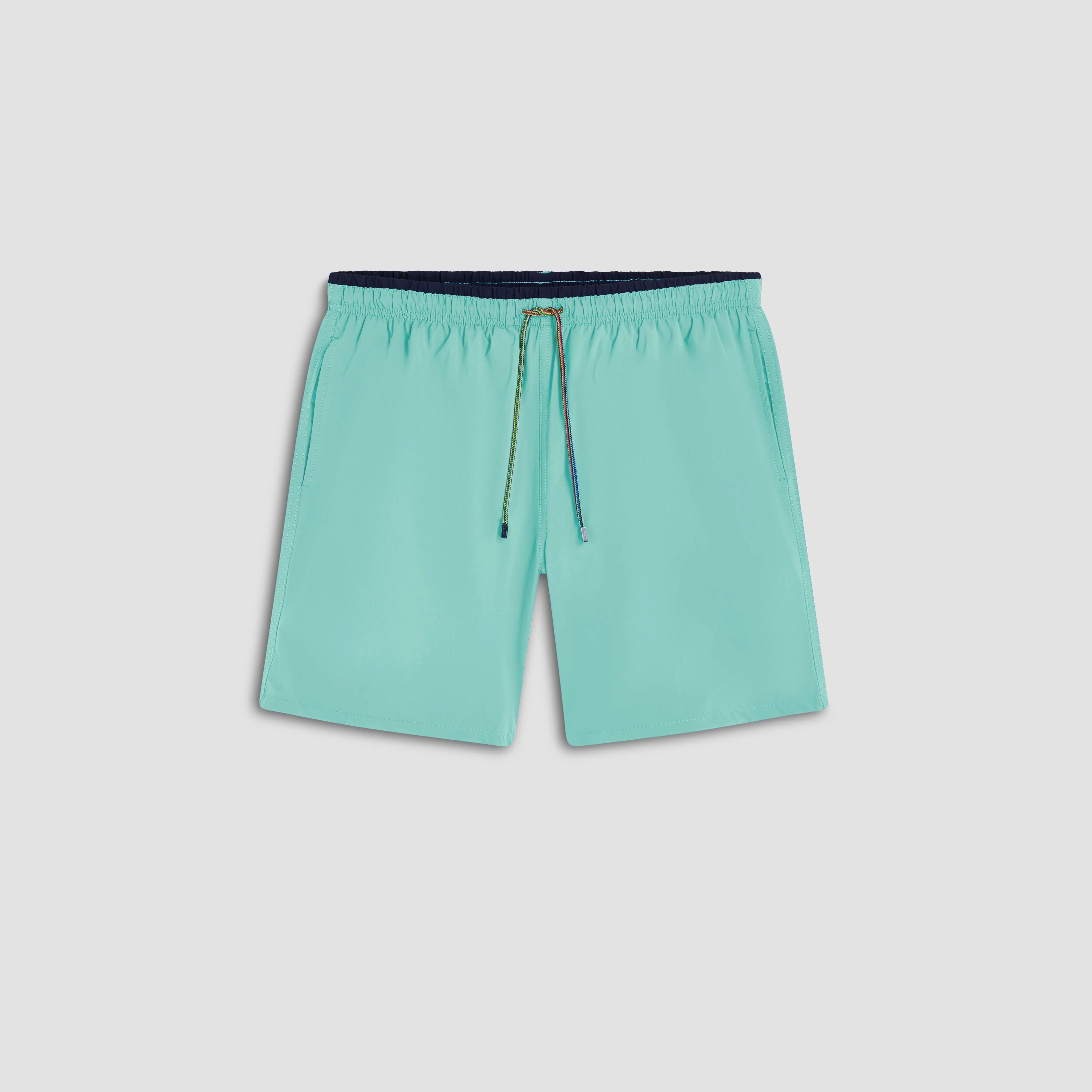 Quinn Solid Swim Trunks sold by Bugatchi