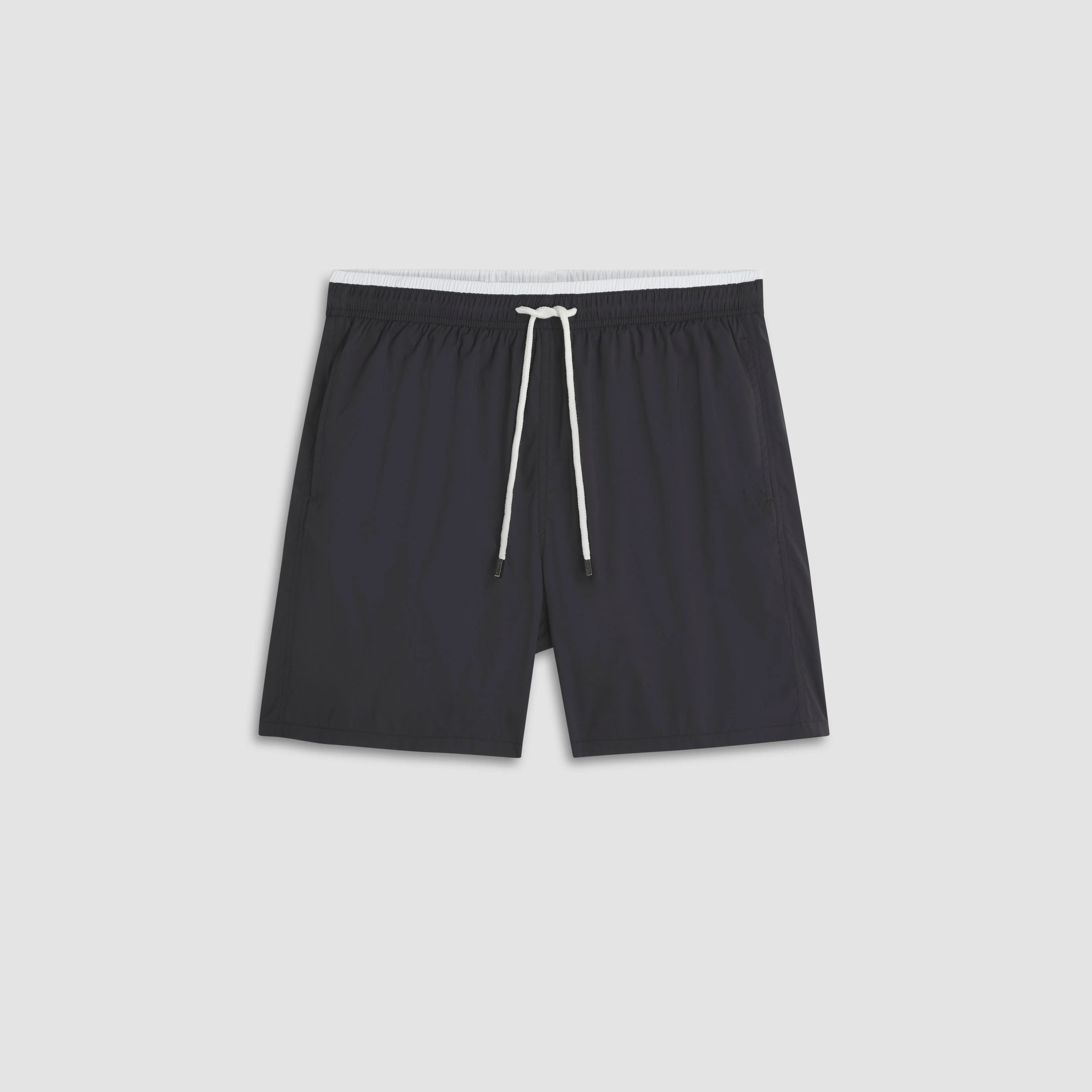 Quinn Solid Swim Trunks sold by Bugatchi
