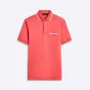 Solid Polo sold by Bugatchi