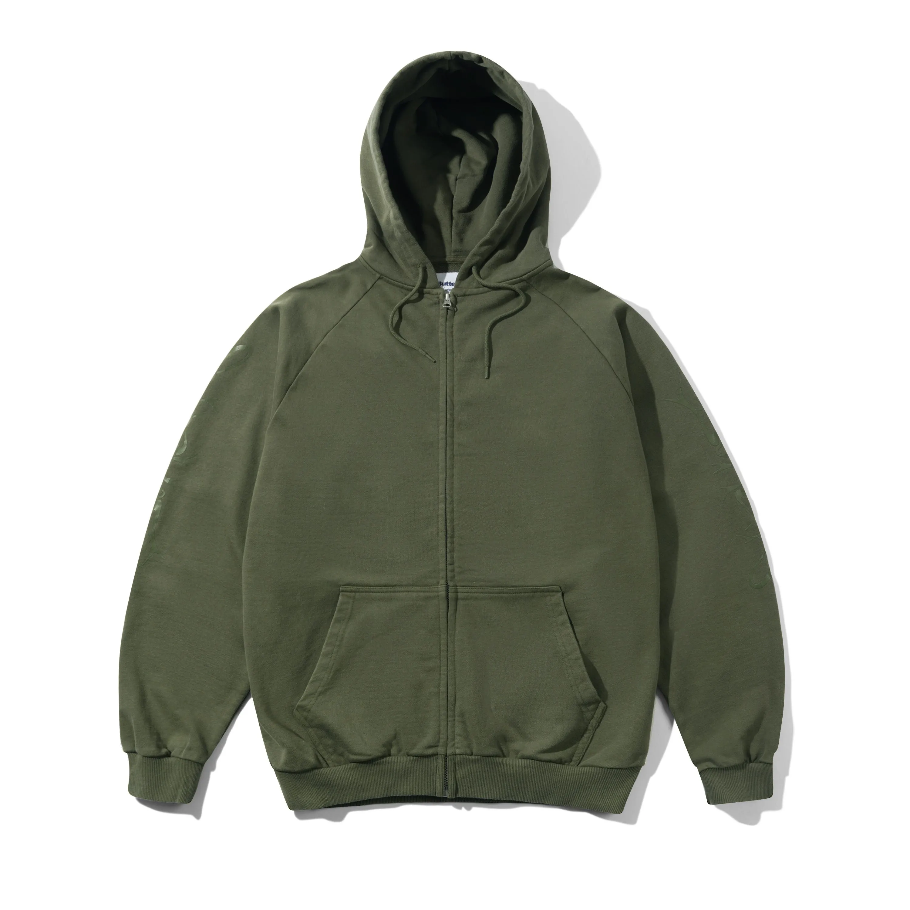 Scrawling Zip-Thru Hood, Washed Dull Army sold by Butter