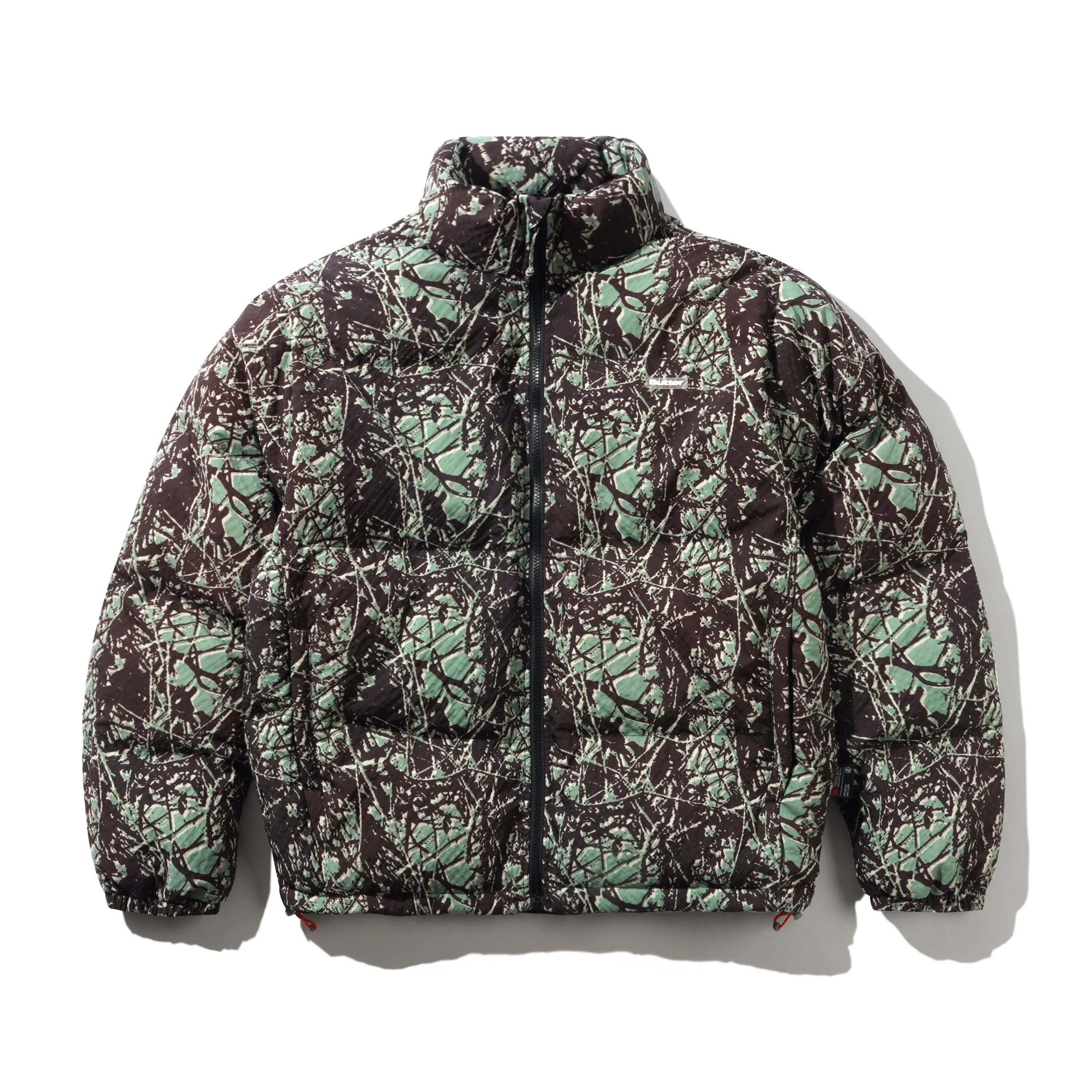 Endure Puffer Jacket, Woods Camo sold by Butter
