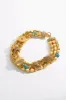 SACRED SYMBOLS STATEMENT NECKLACE GOLD sold by Camilla