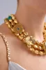 SACRED SYMBOLS STATEMENT NECKLACE GOLD sold by Camilla