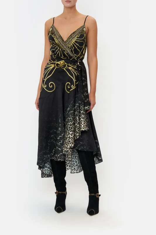 WRAP DRESS WITH RUFFLE HEM SHADOWS OF ARMADA sold by Camilla