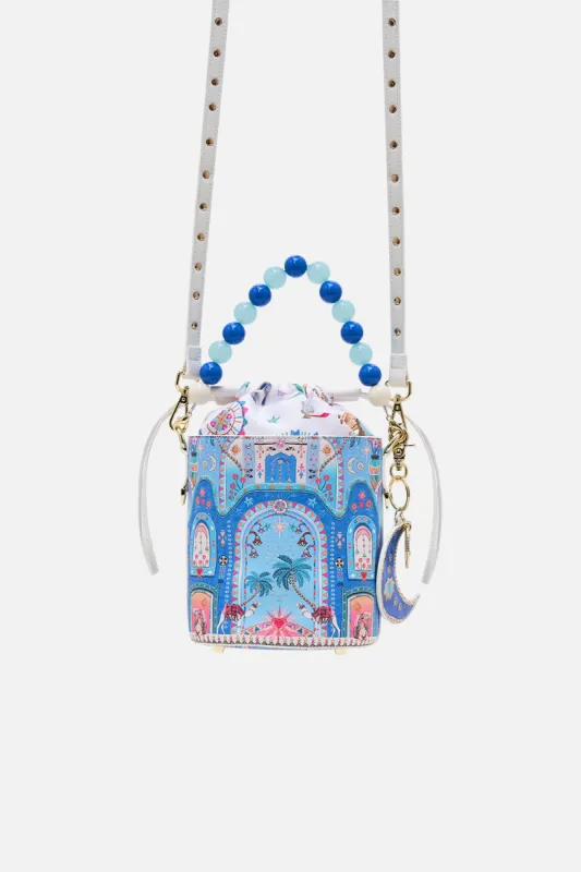 DRAWSTRING BUCKET BAG WITH BEADED HANDLE A PAINTED VILLAGE sold by Camilla