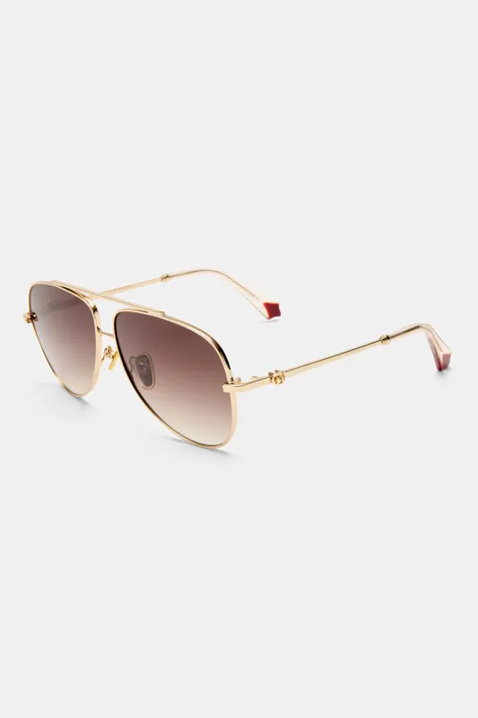 THE VOYAGE SUNGLASSES GOLD / NUDE sold by Camilla