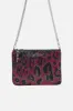 EMBELLISHED ZIP TOP CLUTCH WITH STRAP ALWAYS CHANGE YOUR SPOTS sold by Camilla