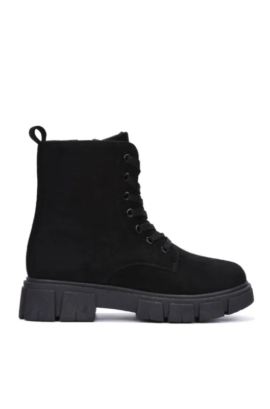Shanda Suede 7-Hole Platform Lug Booties - Black sold by Cape Robbin