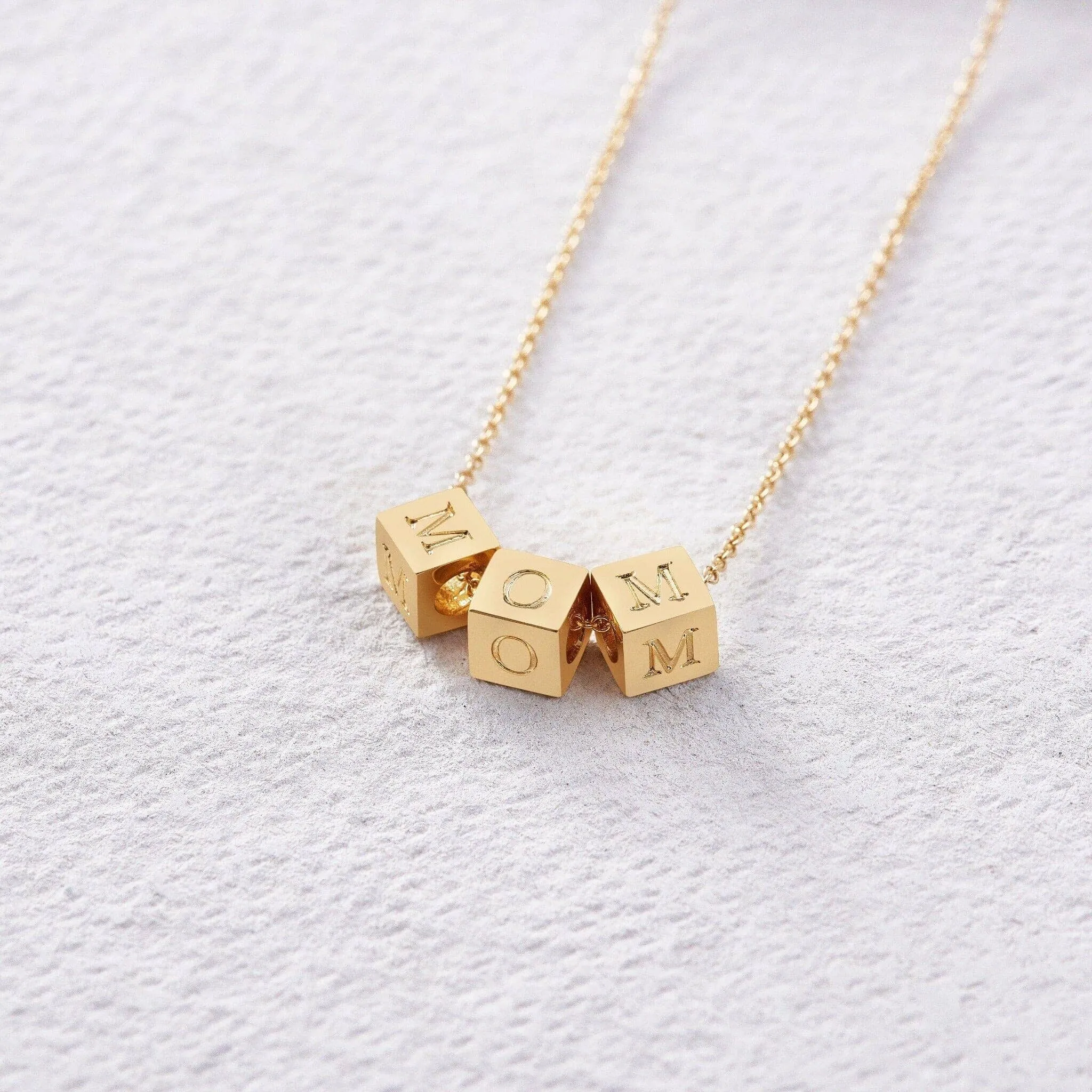 Custom 14k Gold Block Necklace sold by Capsul Jewelry