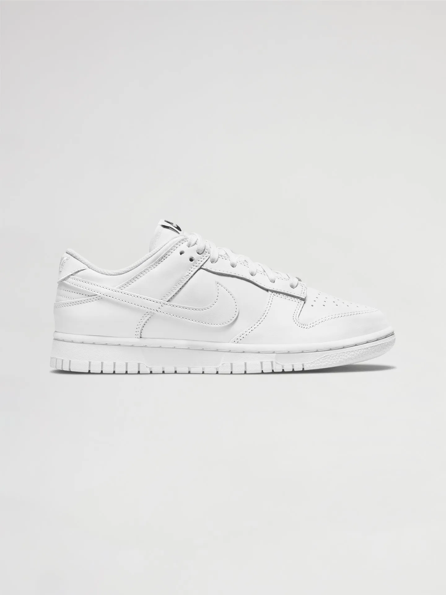 Nike Dunk Low - WHITE/WHITE-WHITE sold by Carbon38