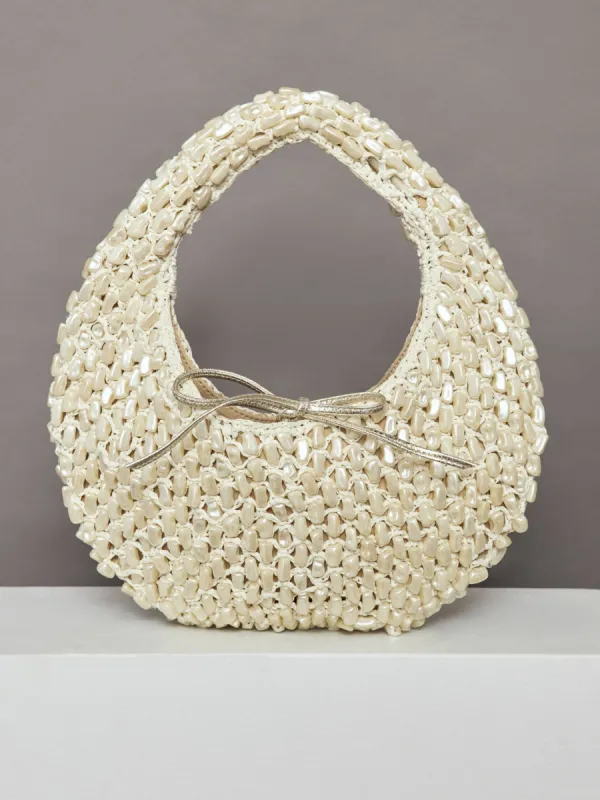 The Josie Tie Bag - Pearl and Raffia sold by Carbon38