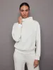 Cowl Neck Knit Sweatshirt in Interlock - Moonbeam Heather sold by Carbon38