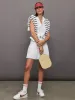 Pleated Tennis Dress in Scuba - White sold by Carbon38