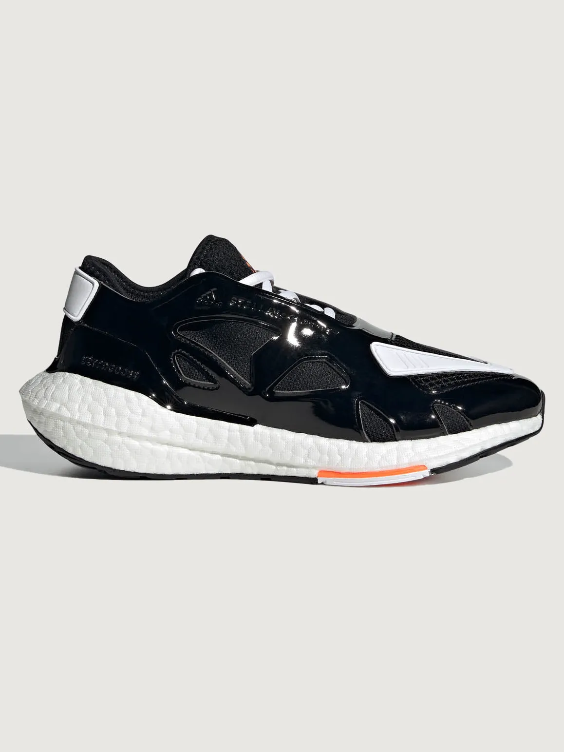 adidas by Stella McCartney ULTRABOOST 22 - CORE BLACK/FTWR WHITE/SIGNAL ORANGE sold by Carbon38