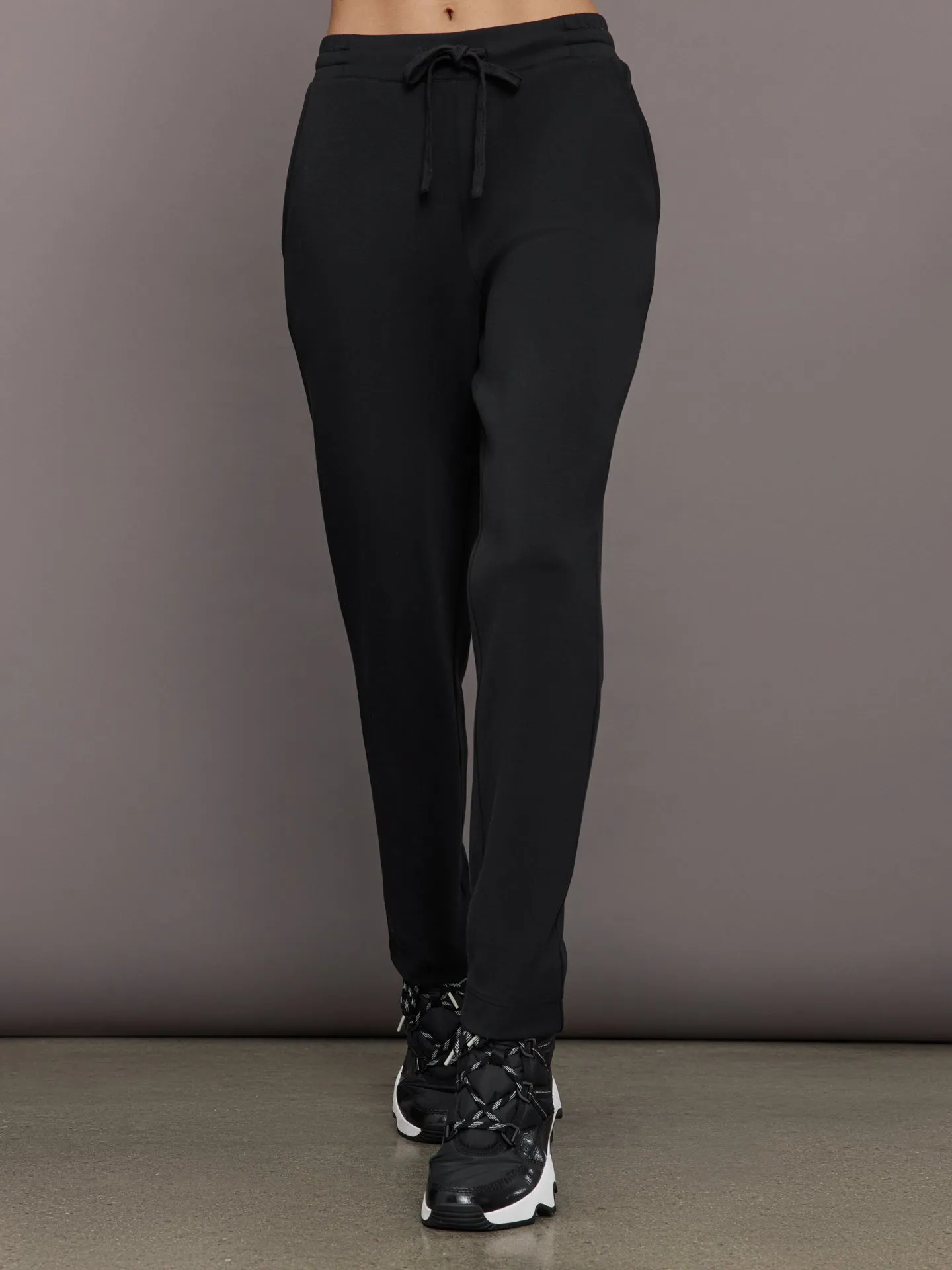 Tapered Leg Jogger in Interlock - Black sold by Carbon38