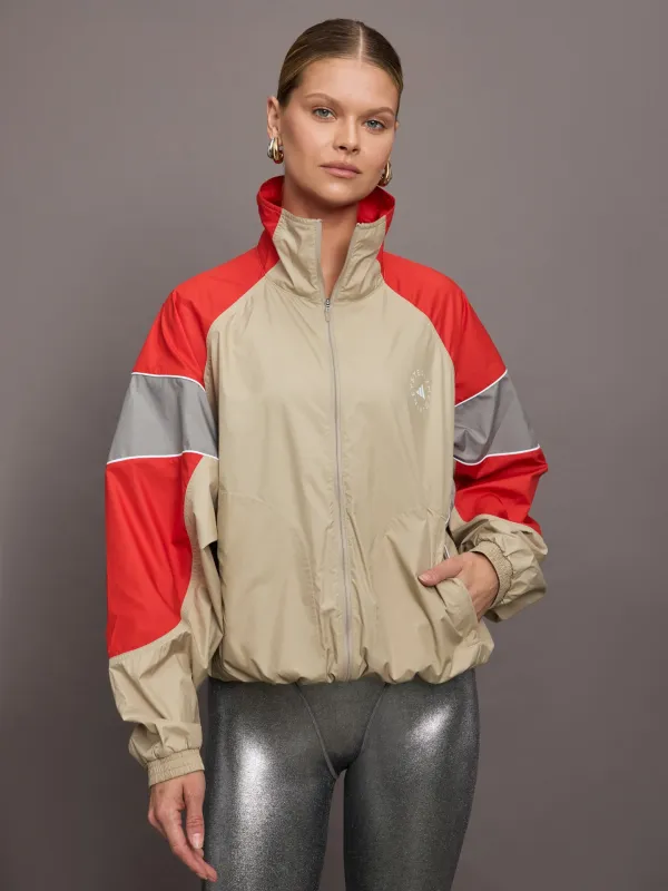 aSMC Track Top - Desert Sand-Smc/Active Red sold by Carbon38
