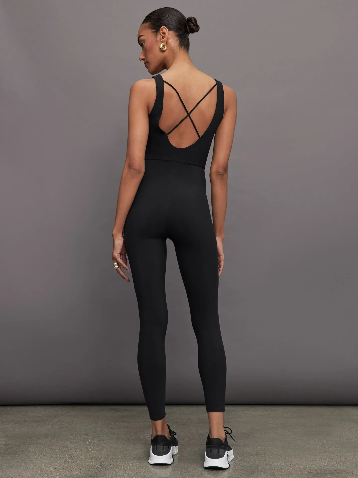 Cross Back Jumpsuit in Melt - Black sold by Carbon38