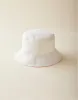 Reversible Bucket Hat: Cloud/Newport sold by Carve Designs