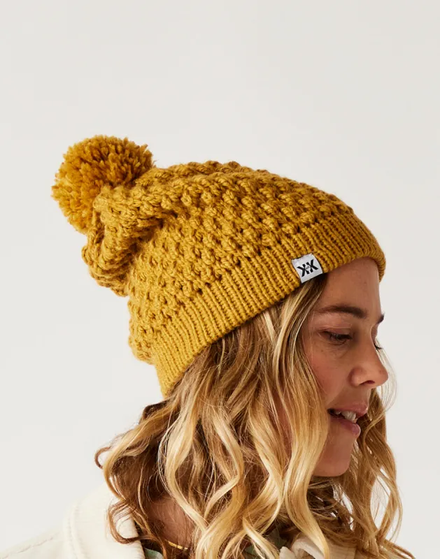 Abby Pom Beanie: Wood sold by Carve Designs