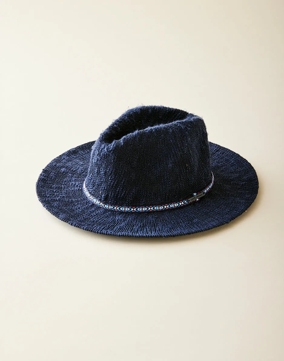 Capistrano Crushable Hat: Navy sold by Carve Designs