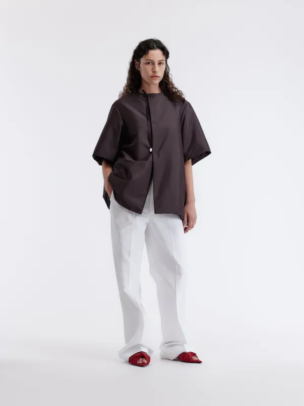 Manteau manches courtes ouatiné en soie technique sold by Carven