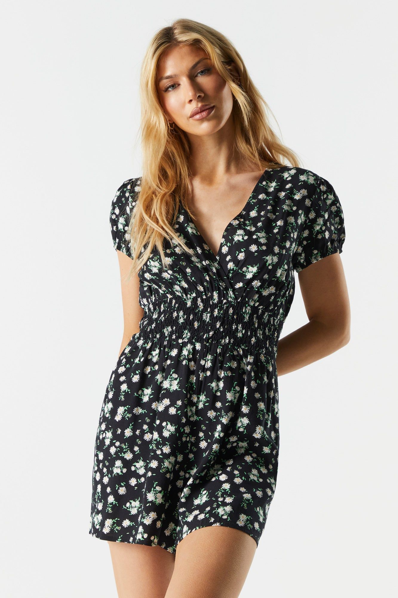 Black Floral Surplice Smocked Romper sold by Charlotte Russe