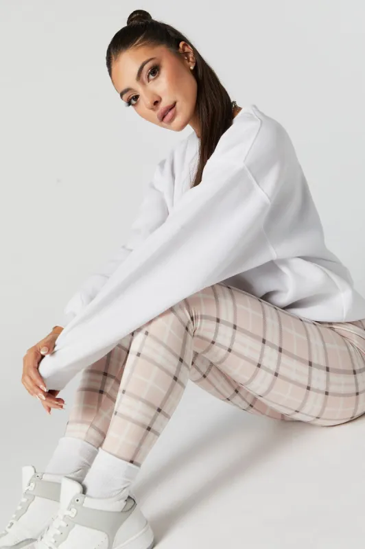 Pink Plaid Print Fleece Legging sold by Charlotte Russe