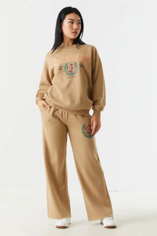 Michigan Graphic Wide Leg Fleece Jogger sold by Charlotte Russe
