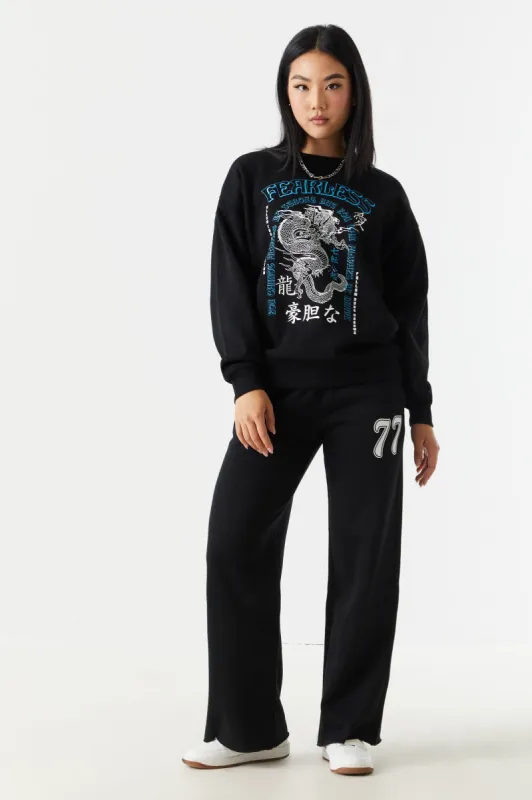 77 Graphic Wide Leg Fleece Jogger sold by Charlotte Russe