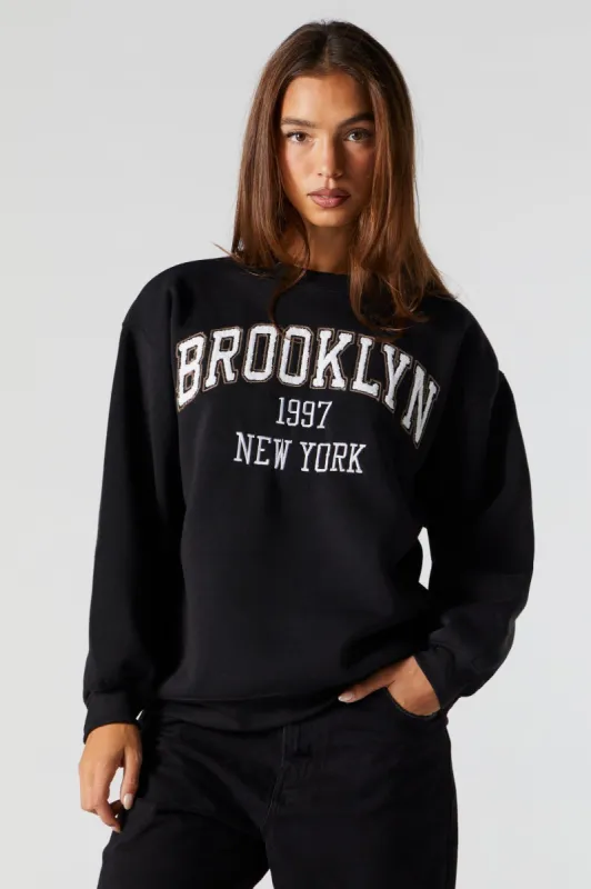 Chenille Embroidered Brooklyn Fleece Sweatshirt sold by Charlotte Russe