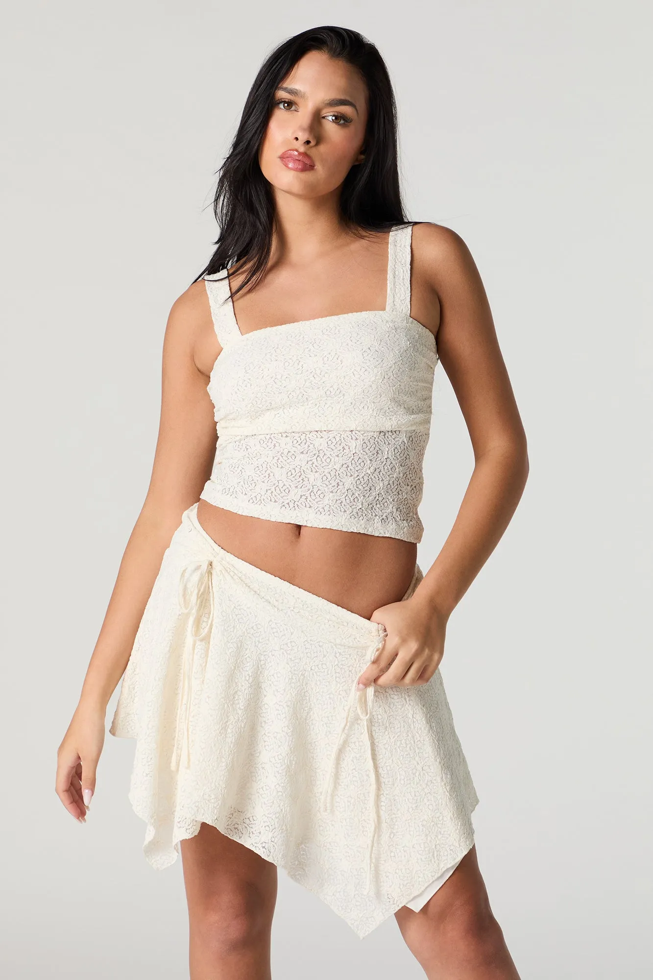 Lace Knit Asymmetrical Mini Skirt sold by Charlotte Russe