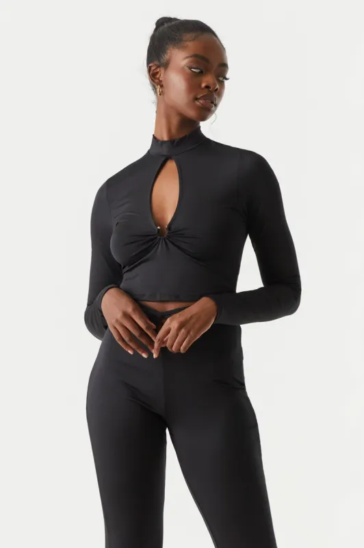 Cut-Out Mock Neck Cropped Top sold by Charlotte Russe