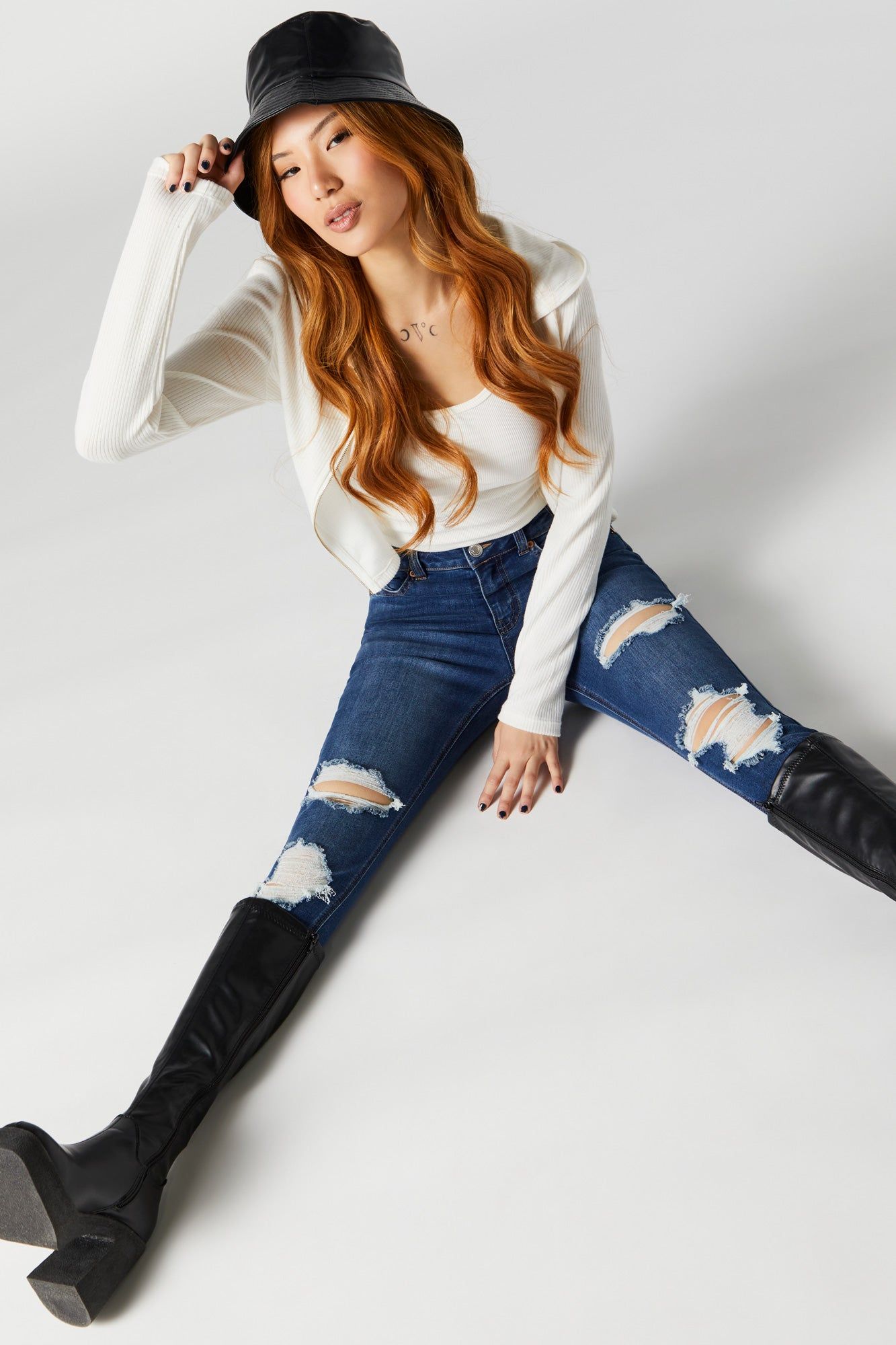 Rio Dark Wash Distressed Mid Rise Jean sold by Charlotte Russe