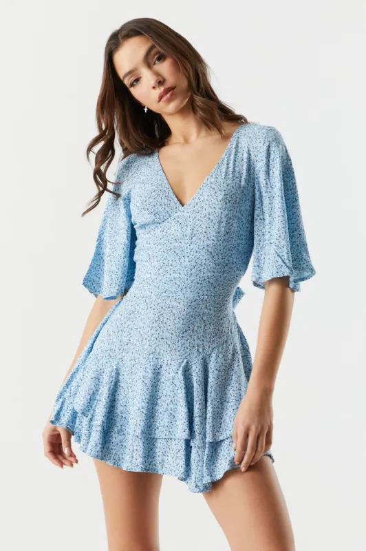 Floral Ruffle Wrap Romper sold by Charlotte Russe