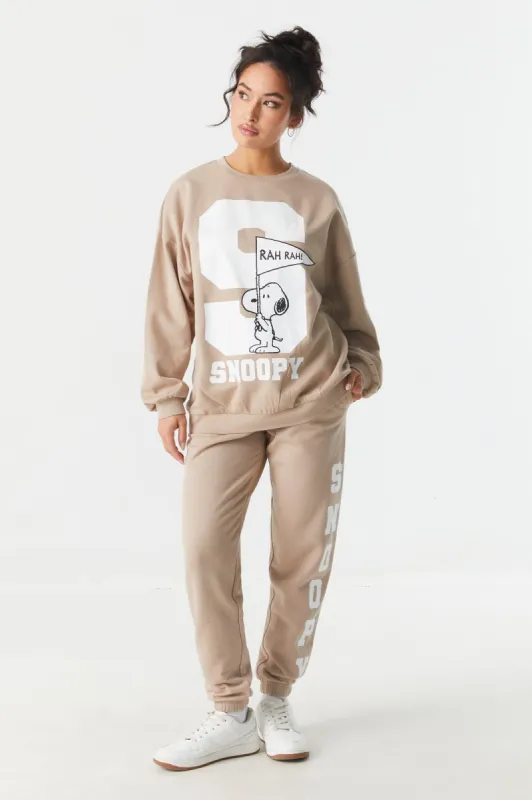 Snoopy Graphic Varsity Fleece Jogger sold by Charlotte Russe