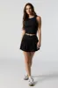 Active Pleated Tennis Skort with Pocket sold by Charlotte Russe