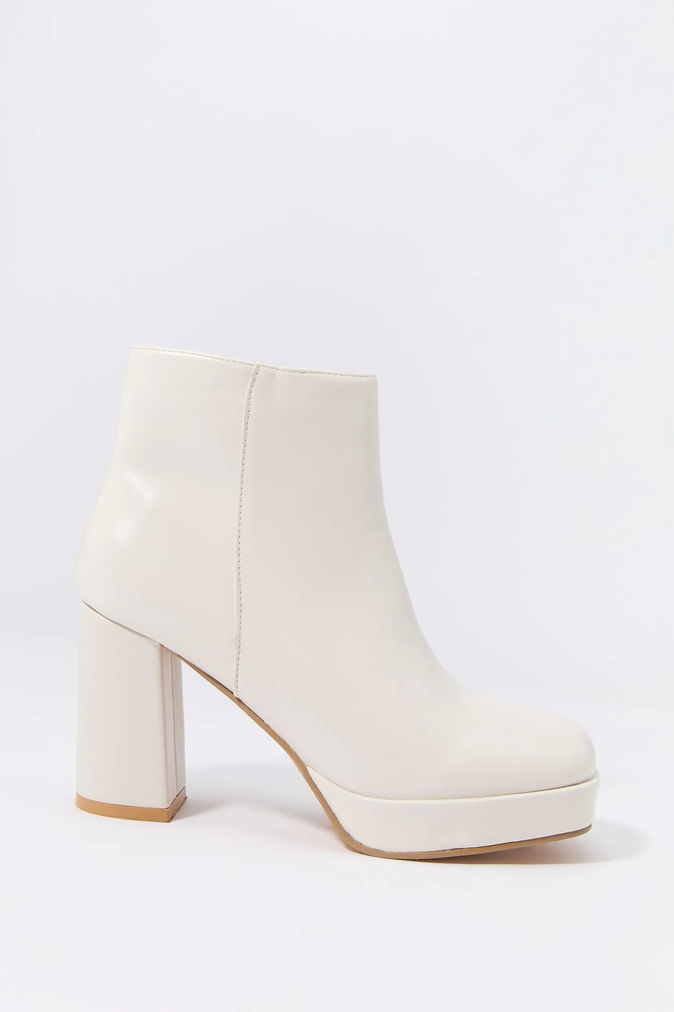 Faux Leather Platform Heeled Boot sold by Charlotte Russe