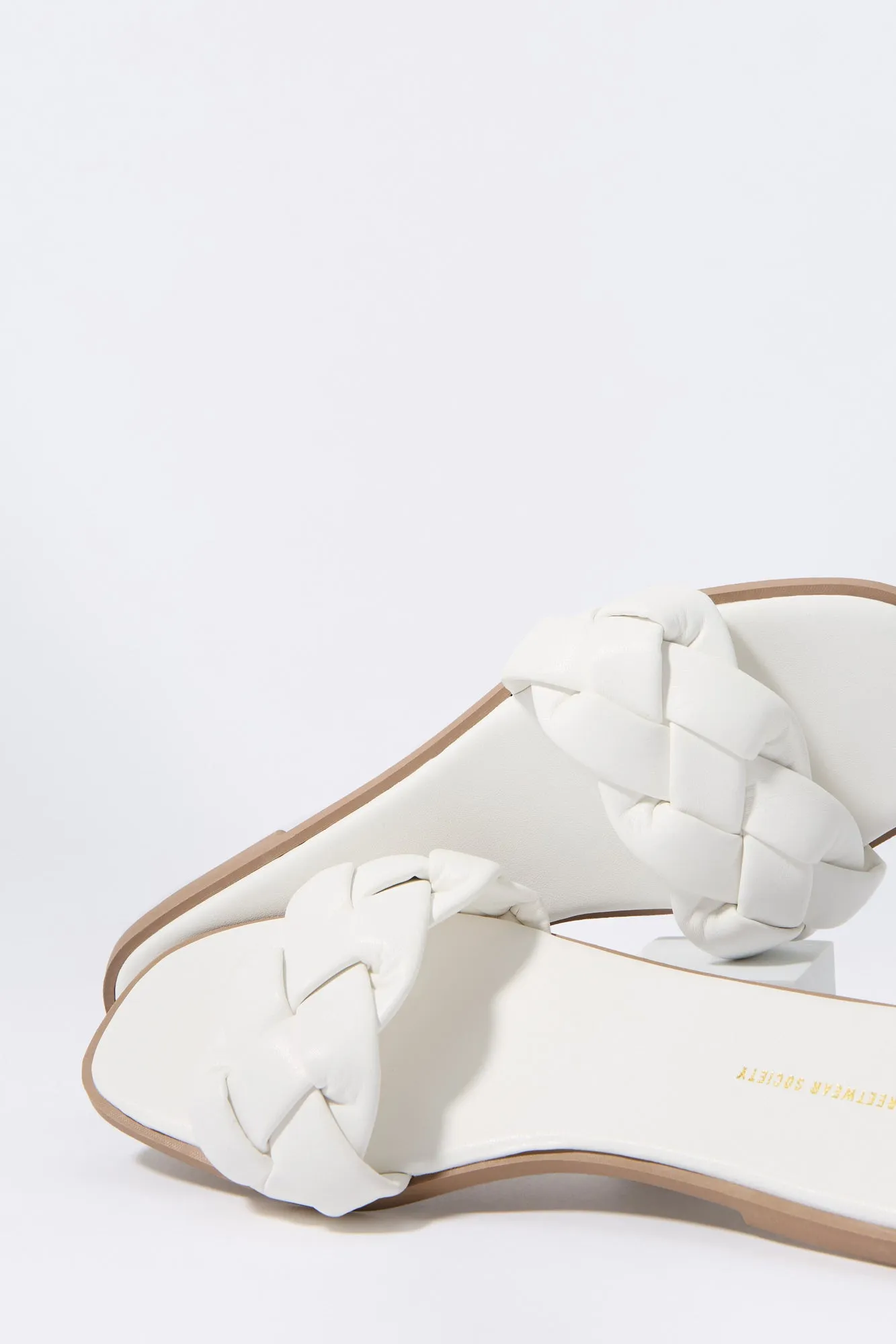 Faux Leather Woven Slide Sandal sold by Charlotte Russe