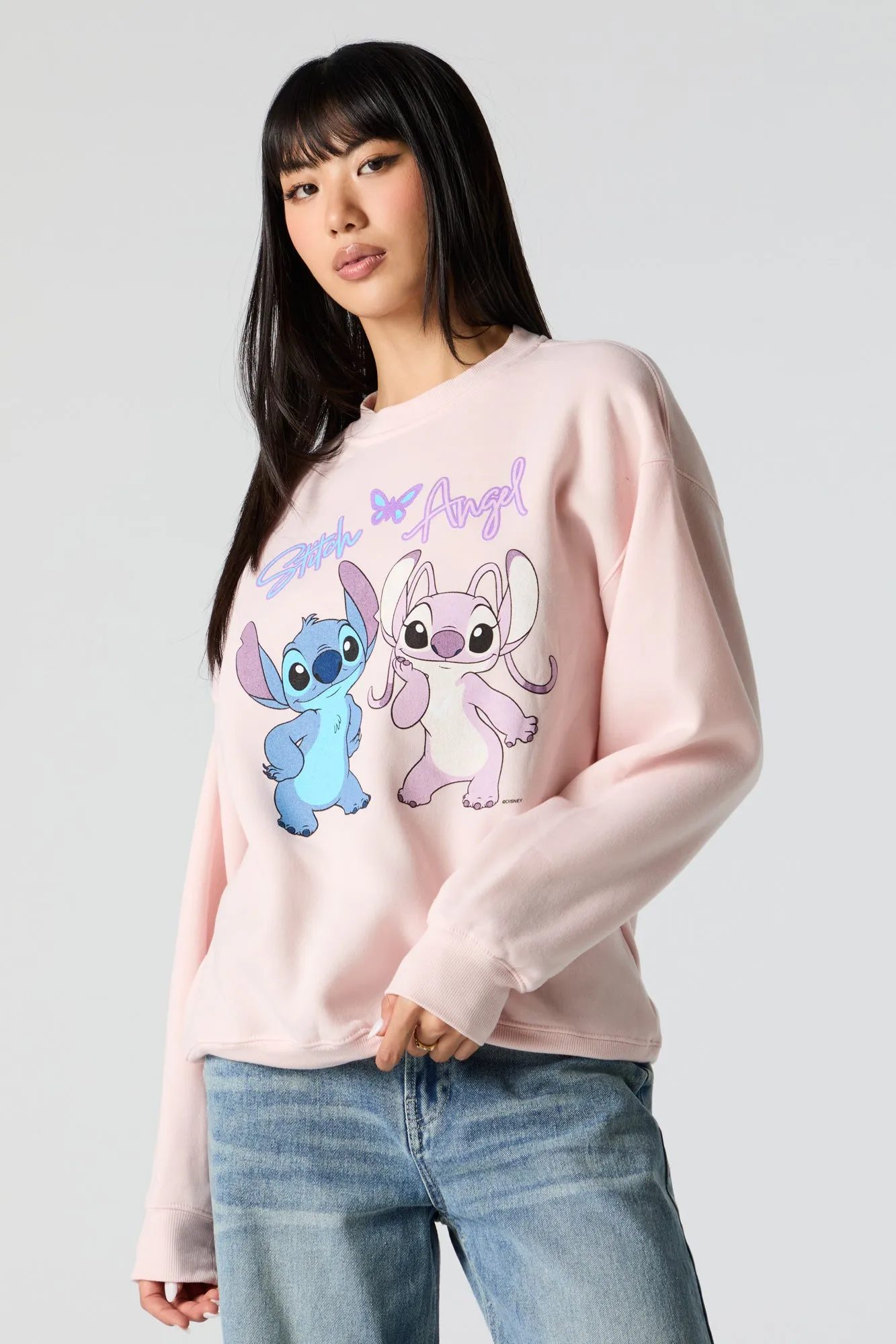 Stitch and Angel Graphic Sweatshirt sold by Charlotte Russe