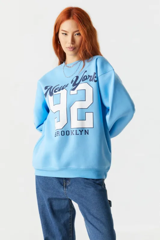 New York 92 Graphic Oversized Fleece Sweatshirt sold by Charlotte Russe
