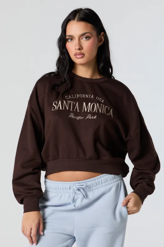 Santa Monica Embroidered Cropped Fleece Sweatshirt sold by Charlotte Russe