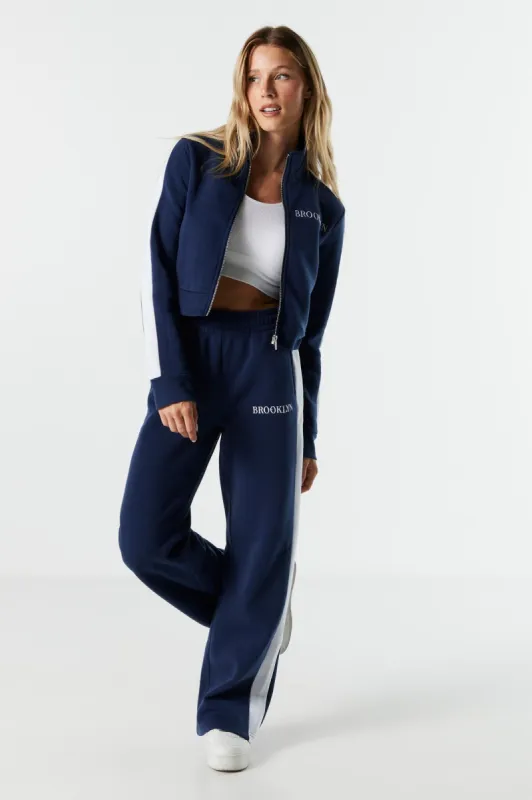 Brooklyn Embroidered Fleece Wide Leg Track Pant sold by Charlotte Russe