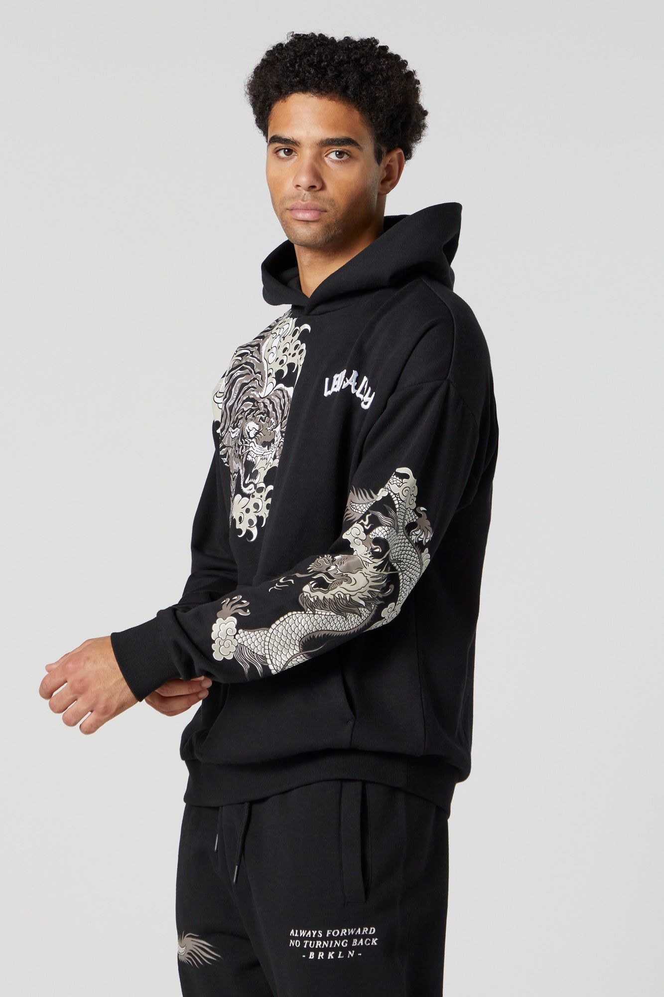 Dragon Graphic Fleece Hoodie sold by Charlotte Russe