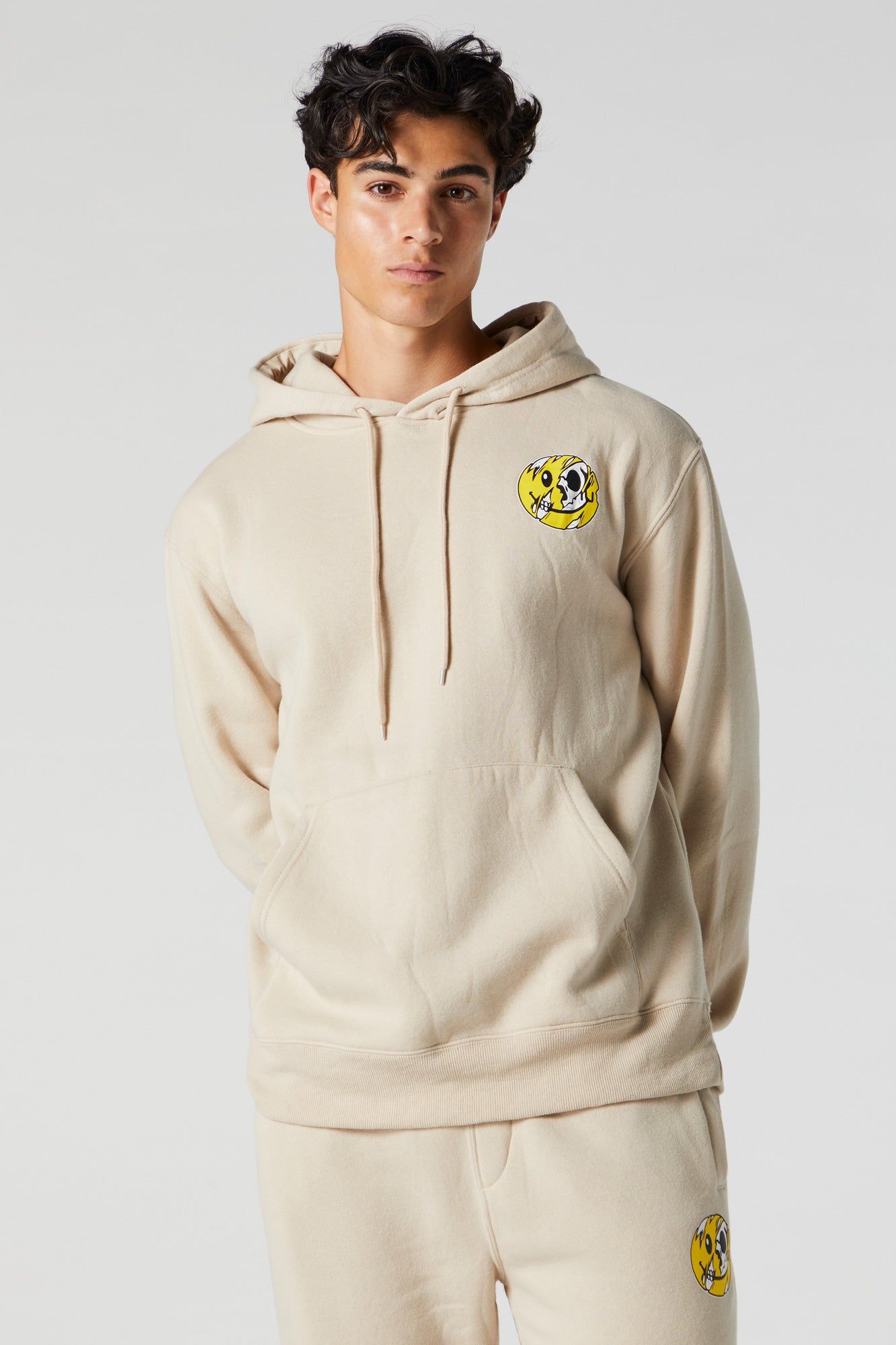 Distorted Smiley Graphic Fleece Hoodie sold by Charlotte Russe