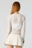 Fishnet Cropped Long Sleeve Top sold by Charlotte Russe