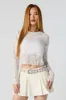 Fishnet Cropped Long Sleeve Top sold by Charlotte Russe