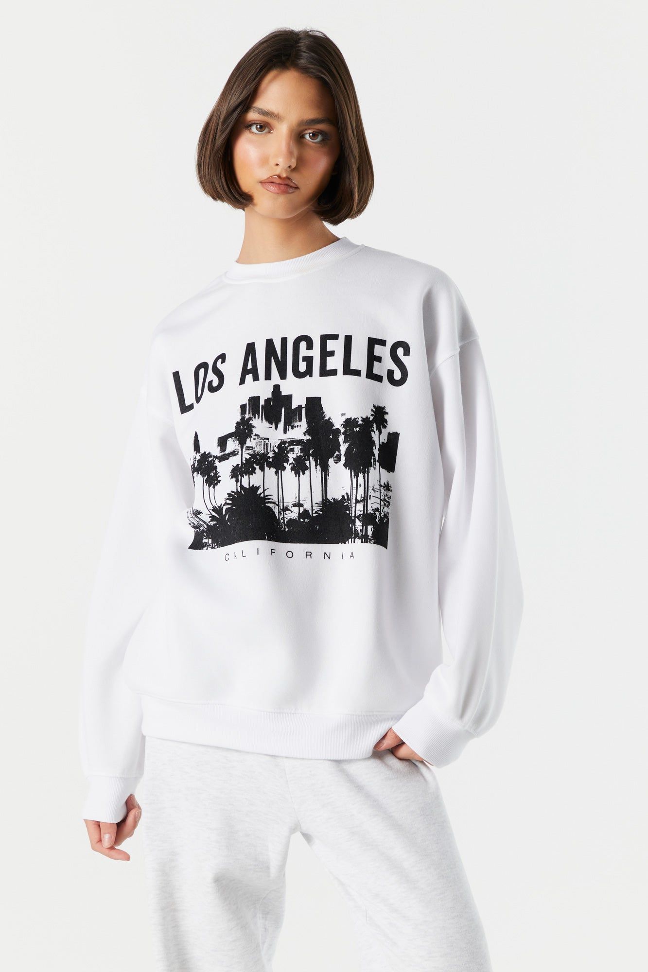 Los Angeles Graphic Fleece Sweatshirt sold by Charlotte Russe