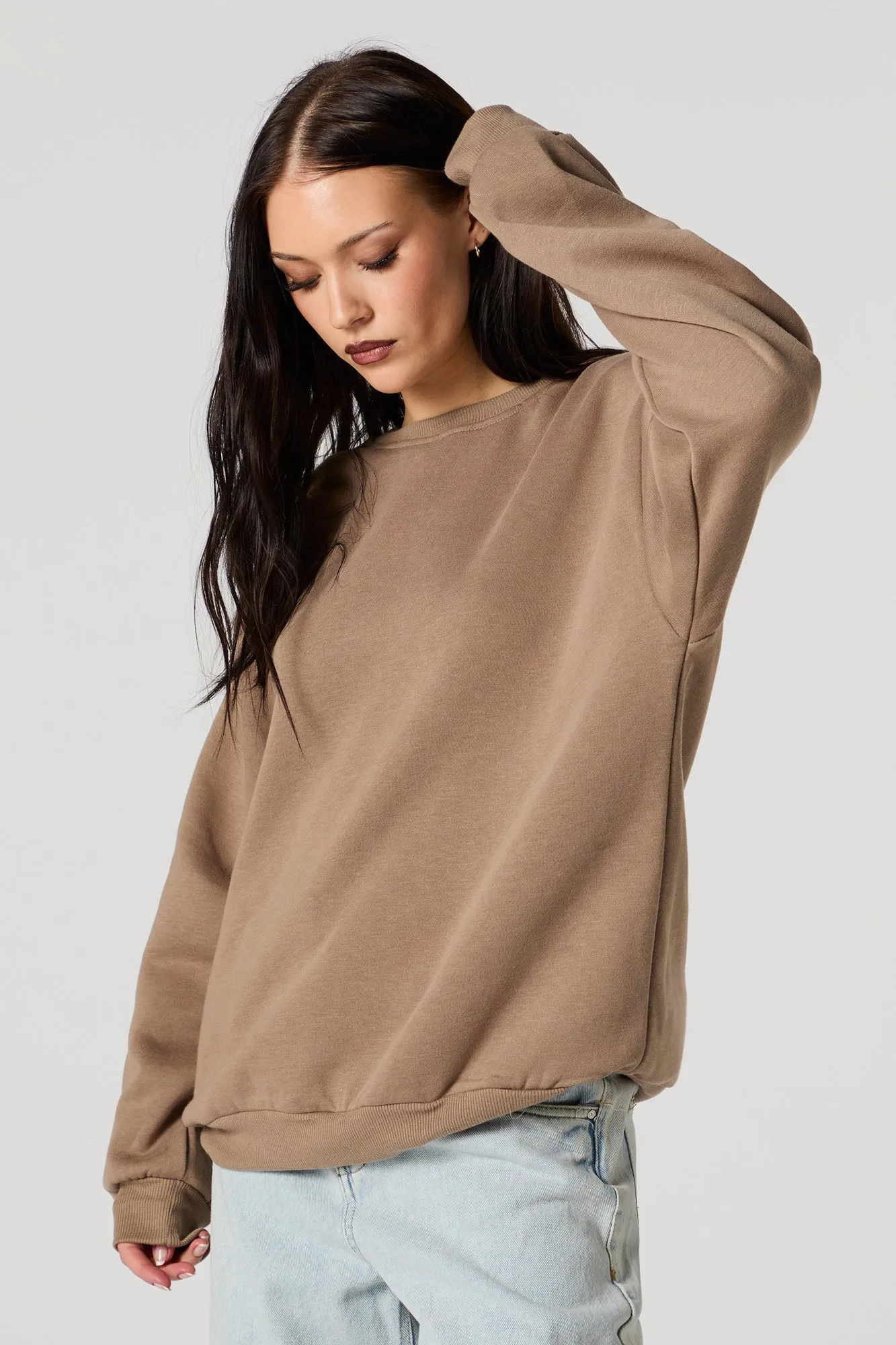 Oversized Fleece Crewneck Sweatshirt sold by Charlotte Russe