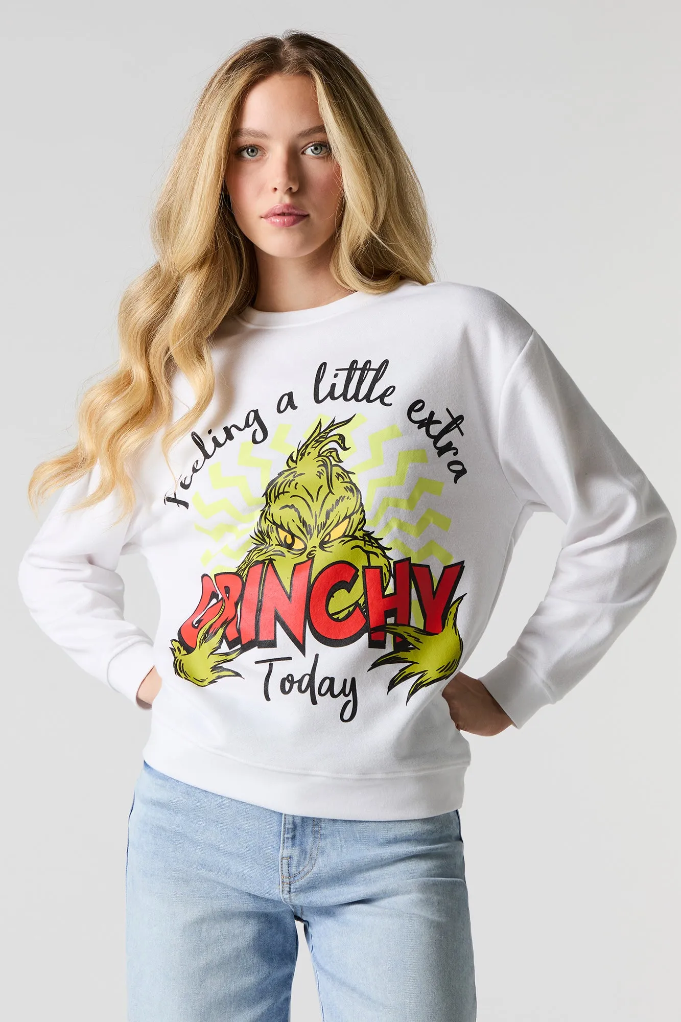 Feeling Extra Grinchy Graphic Fleece Christmas Sweatshirt sold by Charlotte Russe